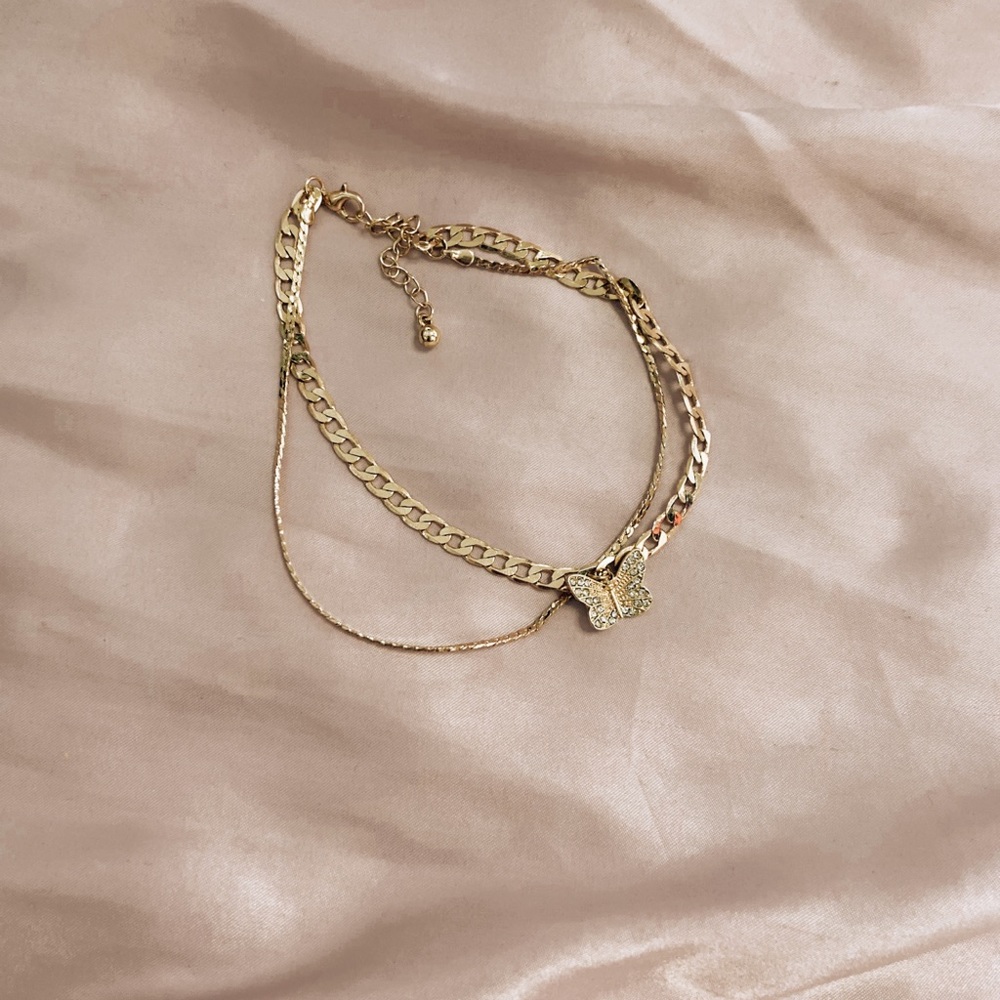 Butterfly pendant gold anklet.